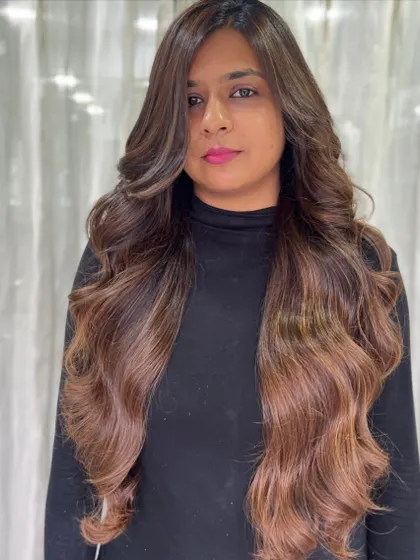 Rocking that rich brown hue. This client is loving her long, wavy hair with beautiful, dimensional color.