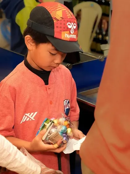 A player carefully selecting his chocolates to take back home.