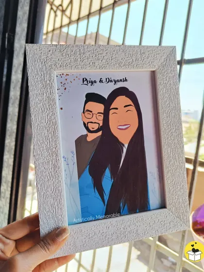 Another view of the personalized couple's portrait, held up to show its details against a bright background. This makes for a wonderful and affordable gift for a fiancé.