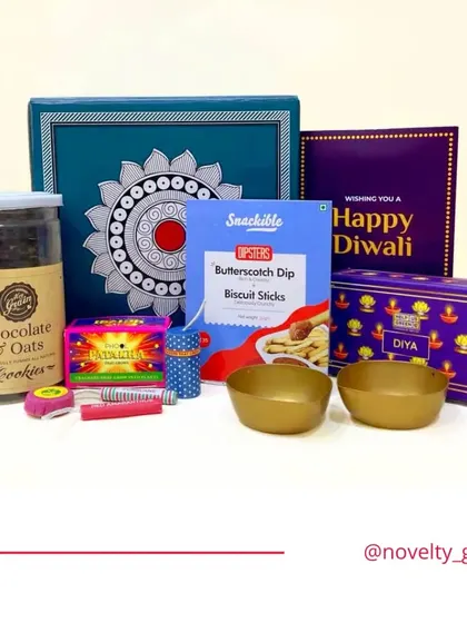 This hamper is curated with a mix of fun and tradition. It includes chocolate and oats cookies, butterscotch dip sticks, firecrackers, and festive bowls.