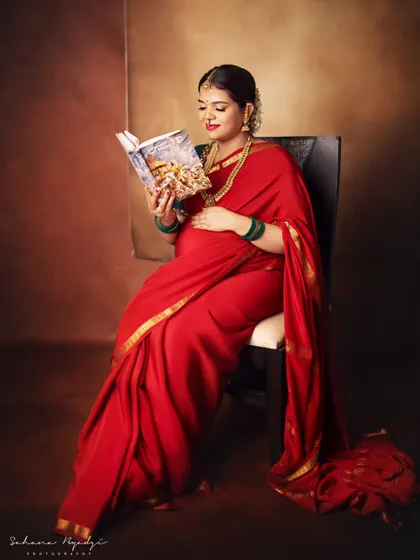 A moment for herself and the baby. The mom-to-be reads a book, a peaceful and classic portrait that speaks to the quiet moments of pregnancy.
