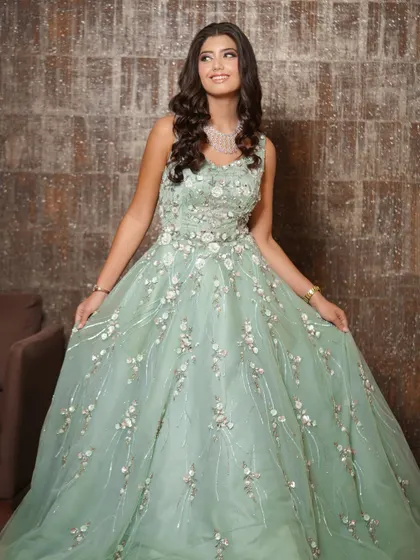 A vision in this pastel mint green gown. I created a soft glam makeup look with peachy glossy lips and gentle waves in her hair to complement the delicate, ethereal feel of her outfit.