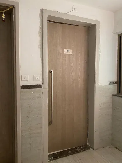 A standard apartment door before our intervention.