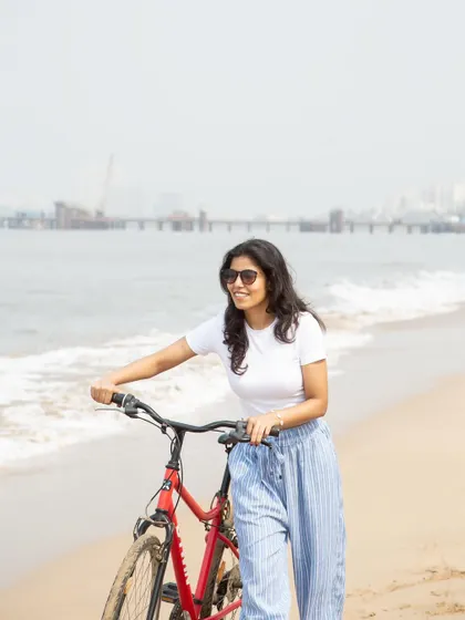 A lifestyle shot with a bicycle on the beach, telling a story of a relaxed and active summer day.