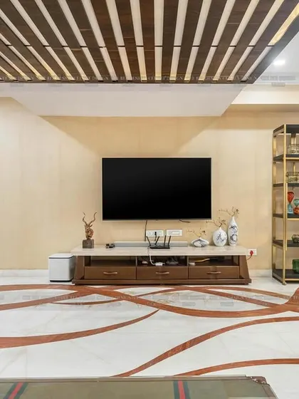 A shot of the living room from image 112, focusing on the intricate marble floor inlay and the slatted wood ceiling design.