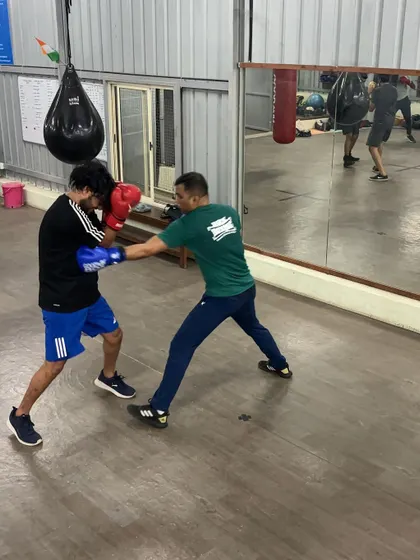 A student lands a clean jab during a sparring drill. We focus on accuracy and using the jab to control the distance.
