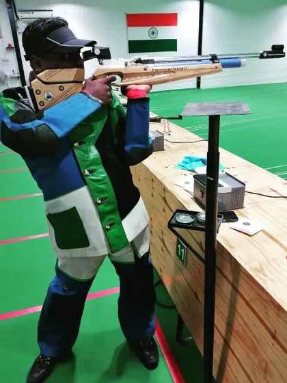 A student practices with a Feinwerkbau air rifle, demonstrating the powerful stance and focus we teach for competitive events.