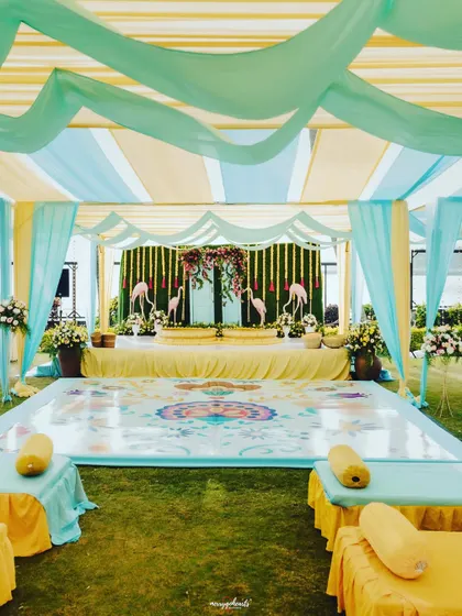 A flamingo-themed Haldi with a cool blue and yellow color palette, creating a fun, tropical vibe.