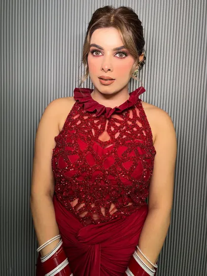 The client looks absolutely radiant in her bold red attire.