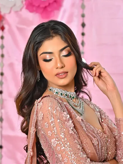 Radiating an effortless glow. This is a beautiful example of a soft glam look with peachy tones, perfect for a day event.