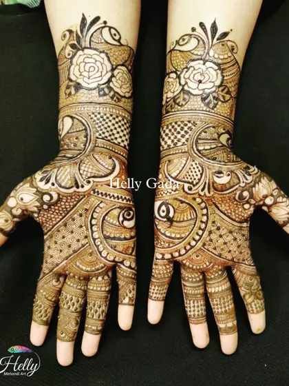 This traditional design is filled with beautiful details, including peacocks and roses. The use of negative space around the white roses makes them a unique focal point of the artwork.