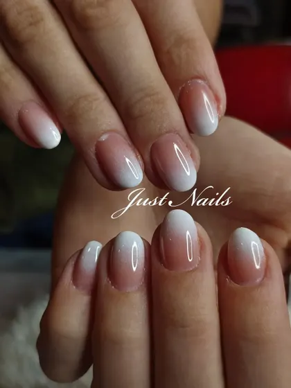 A soft and natural-looking ombre on shorter, rounded nails. This demonstrates that you can achieve a beautiful and elegant "baby boomer" look on any nail length or shape.