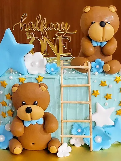 Another adorable "Halfway to One" cake, this time with a cute teddy bear theme. The fondant bears and starry details make it extra special.