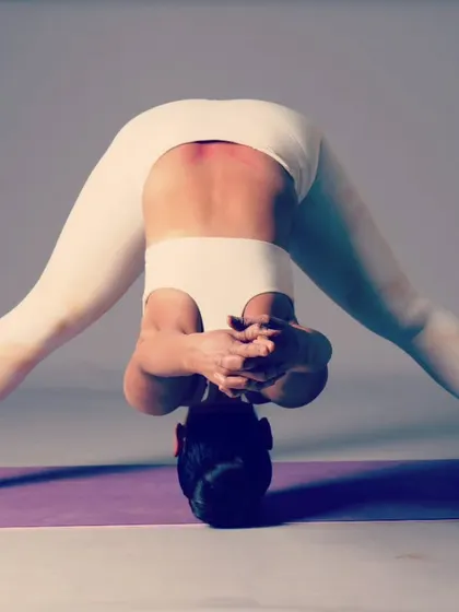 An imperfect picture that was perfect in every way. This is Prasarita Padottanasana, or Wide-Legged Forward Fold, captured during a photoshoot. It reminds me that the journey is more important than perfection.