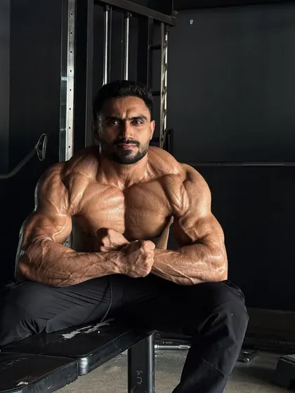 A most muscular pose, showing the chest striations.