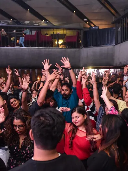 The crowd with their hands up, responding to my call. The interaction between me and the audience is everything.