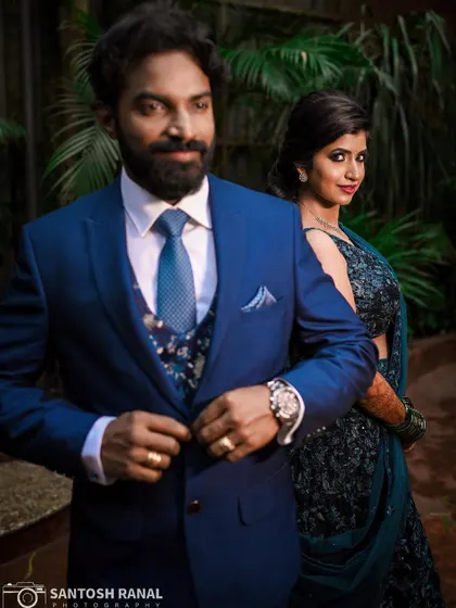 A stylish portrait of the groom with his bride in the background, creating a cool and confident look.