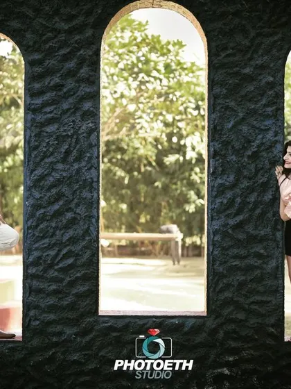 A creative composition using three arched windows to frame the couple. This shot plays with distance and connection in a visually interesting way.