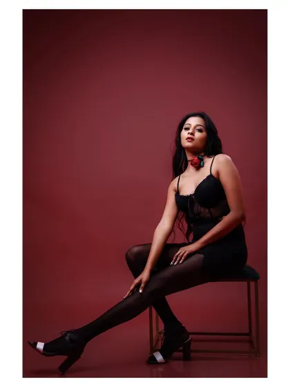A full-length portrait of a model in a little black dress. The pose is classic and elegant, perfect for a portfolio.