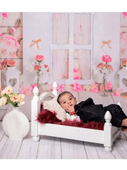 Another beautiful portrait from the 4-month milestone session. The baby's direct look into the camera creates a strong connection with the viewer.