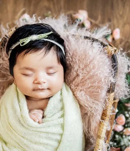 Even after giving us some adorable wide-eyed poses, this little one drifted off for the perfect sleepy shot. Newborn sessions include a mix of both awake and sleeping portraits.