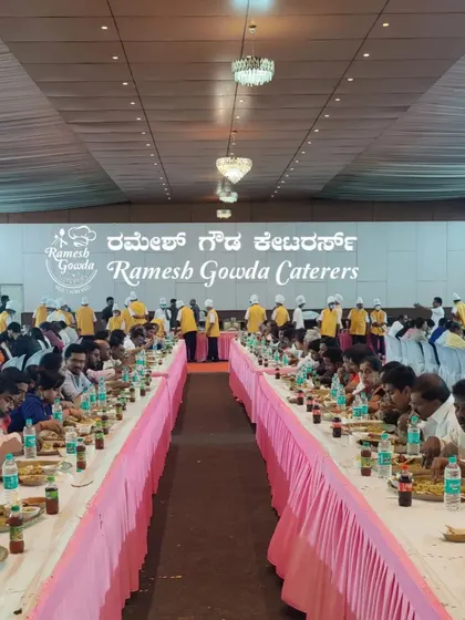 Another view of a large-scale event with our team serving guests. The pink table skirting and organized seating show how we manage the aesthetics of the dining area as well.