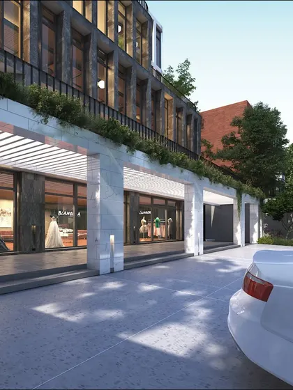 The entrance of the Koramangala office building is designed to be grand and inviting, with a marble-clad portico that provides a sheltered drop-off area.