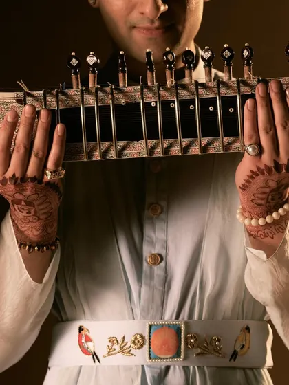 A portrait showcasing the beautiful henna on my hands, a key part of my pre-show ritual.