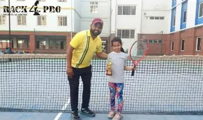 Coach celebrating with our talented lawn tennis player, Bhargavi Aditri, after her remarkable debut performance. This partnership between player and coach is the foundation of our success.