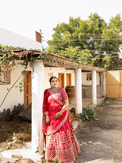 This shot captures the bride in a rustic, traditional setting, showing how a classic bridal look can be perfect for a hometown wedding.