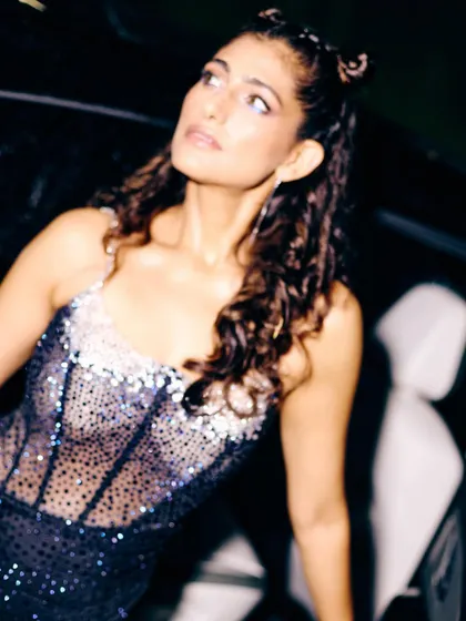 A close-up on the embellished details of the dress for Kubbra Sait's character. The stardust effect of the fabric was meant to make her shine on screen, reflecting her larger-than-life personality.