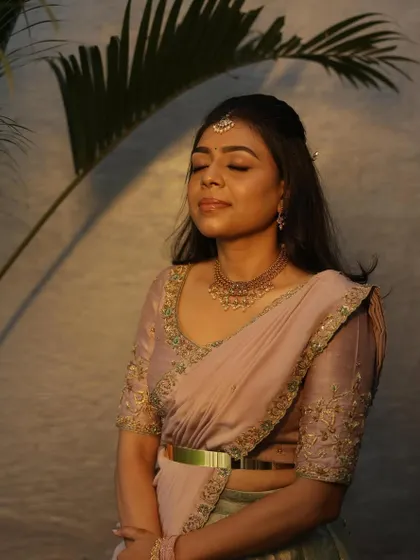 A serene portrait of Dr. Tushara, looking peaceful and beautiful in her custom outfit.