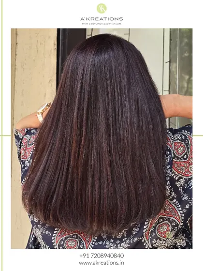 The back view of our mahogany brown color service, showing the incredible shine and sleek, healthy finish.
