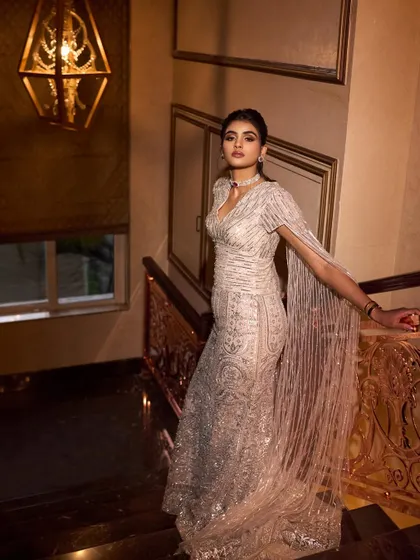 A full-length shot of Manisha's engagement gown, showcasing its elegant silhouette and intricate beadwork. A perfect example of modern glamour.