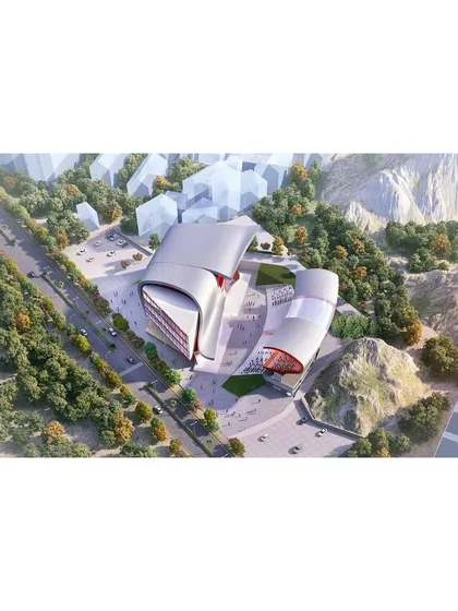 An aerial view of the proposed rock climbing arena, showing how the two main structures are placed on the site to create a central public plaza. The design responds to the surrounding topography, with the building forms echoing the nearby hills.