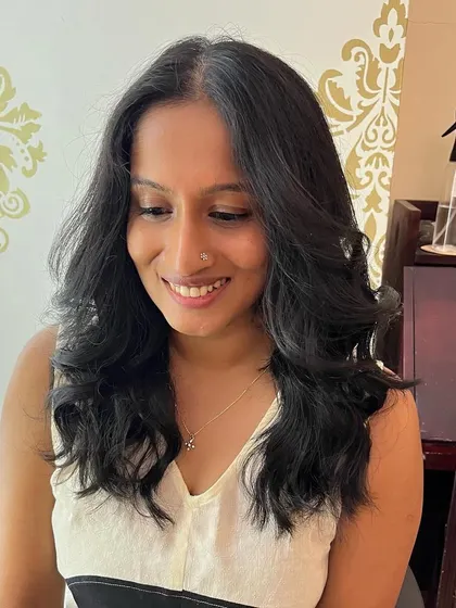 Invisible layers and curtain bangs for Shruthi.