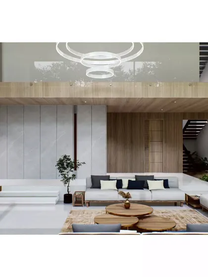 Another view of the Aakiri Residence interior, showing how the living space is organized on multiple levels. A raised platform defines a more intimate seating area, while the open plan maintains a connection to the larger, light-filled volume.