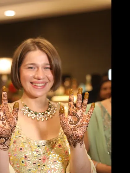 It's always special to apply mehandi for international guests and make them part of our Indian wedding traditions. Her smile shows how much she enjoyed the experience.