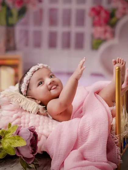 A happy wave from the princess. I love interacting with older babies to bring out their smiles and capture their playful side.