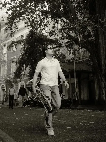 A black and white shot from my "Who I Am" series, walking through the streets of Mumbai with my sitar.
