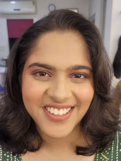 A close-up of the smiling straight makeup look. You can see how the makeup enhances her features while still looking incredibly natural.