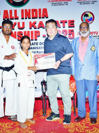 This student's hard work paid off. Here she is receiving her award at the All India Shito-Ryu Karate Championship, showing great potential in her karate journey.