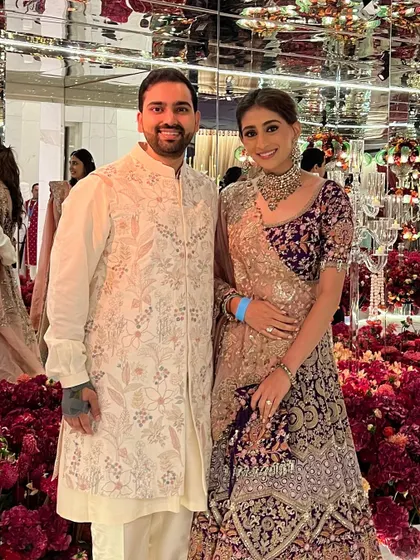 A stunning guest look for the Ambani wedding. The intricate purple and gold lehenga is paired with a soft, elegant makeup look.