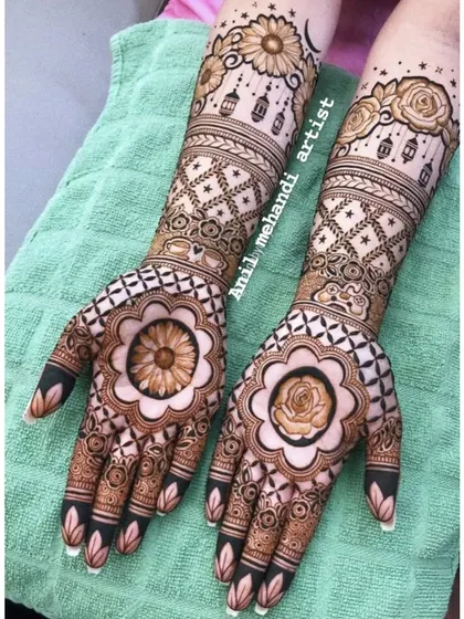A beautiful floral design with large sunflowers and roses on the palms. The hanging lanterns on the arms add a whimsical touch.