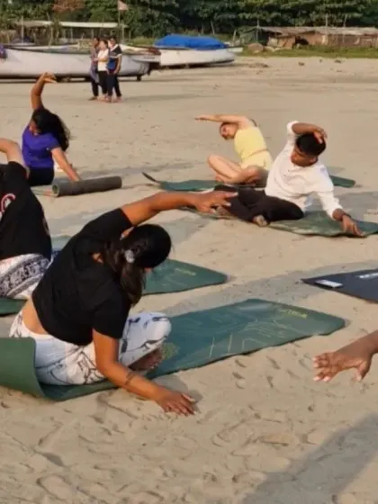 Flowing together with the rhythm of the waves. This side-body stretch feels incredible when you're grounded in the soft sand, connecting your movement to the natural world around you.