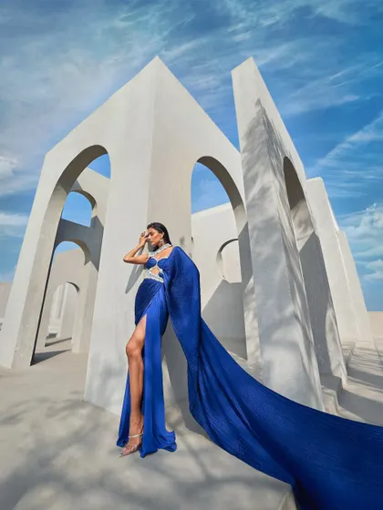 Refractions of elegance, draped in perfection. This active blue sari, inspired by the brilliance of a prism, shimmers with pearl embellishments.