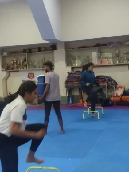 A group of students engaged in various conditioning exercises. We create a circuit of drills to keep the workout dynamic and comprehensive.
