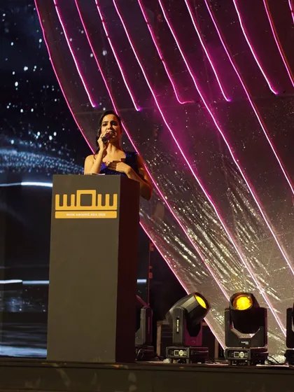 Addressing the audience at the WOW Awards. My role is to guide the evening, introduce the presenters, and celebrate the winners with grace and energy.