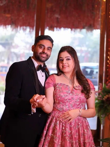 A classic portrait of the happy couple. The bride's makeup is soft and elegant, a perfect match for her beautiful pink gown.