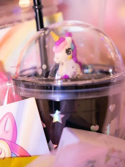 It's all about the little details. These unicorn-themed party favors, complete with custom cups and gift boxes, are an example of how I ensure every part of an event is perfectly on-theme.